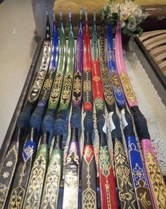 a bunch of different colored umbrellas lined up on a table