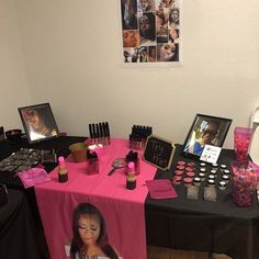 the table is covered with makeup and pictures