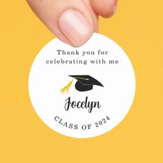 a hand holding a graduation sticker with the words, thank you for celebrating with me