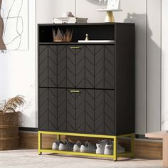 a black cabinet with yellow legs and some shoes on the bottom shelf next to it