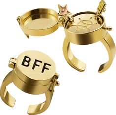 two gold rings with the letters b f and star on them