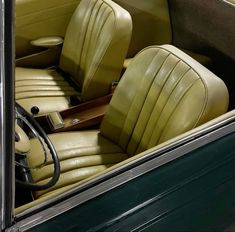 the interior of an old car with leather seats