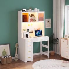 a white desk and chair in a room with green walls, rugs and furniture