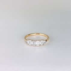 three stone diamond ring in yellow gold