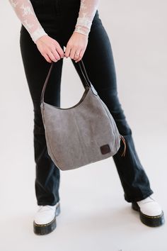 Our Anniston hobo bag is as cute as it is functional. It comes with two magnetic-snap compartments on top of each side of the main zipper-enclosed compartment. This makes it a breeze to throw in your phone or keys that you might need quick and easy access to, while still being able to zip up your wallet or cash in a more concealed and safe compartment. You're going to love the size of this bag too. it's big enough to store your necessities, but you'll never feel like you're carrying around a bul Casual Shoulder Bag With Zipper For Everyday Use, Casual Everyday Shoulder Bag With Zipper, Functional Everyday Hobo Bag With Zipper Pocket, Versatile Canvas Hobo Bag For On-the-go, Versatile Everyday Hobo Bag With Zipper Pocket, Everyday Hobo Shoulder Bag With Zipper Pocket, Canvas Hobo Bag With Zipper Pocket For Everyday, Casual Hobo Bag With Removable Pouch For Everyday Use, Trendy Hobo Satchel For Everyday Use