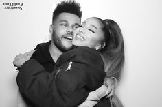 a black and white photo of a man hugging a woman