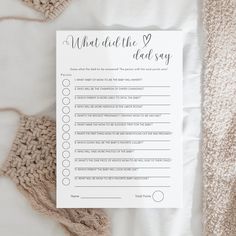 a printable what did the 2 dad say? game on a bed with crocheted blankets