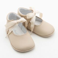 The Baby Beau & Belle Tan Tie Mary Janes complete her outfit! These shoes are hand made for Baby Beau & Belle. They are made with tan matte leather with beautiful scallop edge detail and complimenting cotton ribbon tie for an easy and comfortable fit. They also come in a variety of colors so you can match to any of our collections for that extra touch. Give her feet a special treat with the Baby Beau & Belle Mary Janes. 100% leather Handmade in Spain Shoes are accurate for length, but may be tig Heirloom Gifts, Cotton Ribbon, Scallop Edge, Create Outfits, Kids Ideas, Girl Shoes, Ribbon Tie