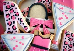 decorated cookies with pink and black designs on them