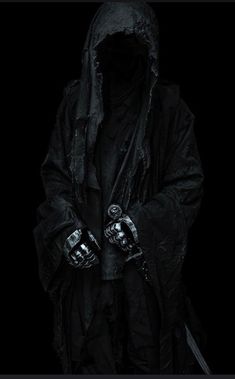 a man in a black hooded jacket holding two knives and wearing gloves with both hands