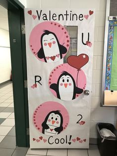 valentine's day door decoration with penguins and hearts