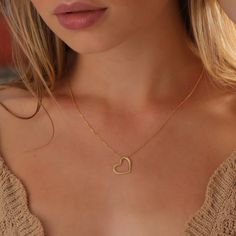 Dainty and timeless jewelry pieces that are made to elevate those everyday moments and bring you into your feminine power. Dainty Heart Outline Necklace is the perfect gift for Life's special moments, such as Christmas, Valentine's Day and Mother's Day. ♡ DAINTY∙ HEART∙ NECKLACE ◇  ◇ Made to Order ◇ Dimensions: 17 mm x 15 mm  ◇ Material Options: High Quality 925 Silver and 14K Solid Gold ◇ Color Options: Gold ∙ Rose Gold ∙ White Gold ◇ All our jewelry is handmade with passion and care in our wor Mother's Day Heart Charm Necklace With Clavicle Chain, Mother's Day Heart-shaped Clavicle Chain Charm Necklace, Heart-shaped Clavicle Chain Necklace For Mother's Day, Mother's Day Heart Shaped Clavicle Necklace, Heart Pendant Necklaces With Heart Beads For Mother's Day, Heart Beads Necklace With Heart Pendant For Mother's Day, Mother's Day Necklace With Heart Beads And Pendant, Heart Shaped Delicate Chain Necklace For Mother's Day, Heart-shaped Delicate Chain Necklace For Mother's Day