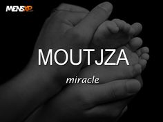 two hands holding each other with the words moutaza in white