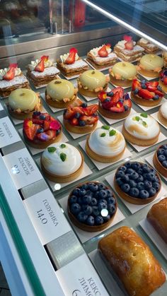 a display case filled with lots of different types of pastries