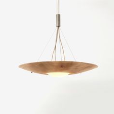 a wooden light fixture hanging from a ceiling