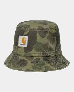 Color: Green / Office Green (garment dyed) - The Duck Bucket Hat is an unlined, unstructured style made from Dearborn Canvas and features an allover camouflage print. The item has also been garment-dyed for a softer feel and complex color configuration. A woven Square Label completes the design. S/M: 56 cm - 22.0 inch, M/L: 59 cm - 23.2 inch, L/XL: 61 cm - 24.0 inch, 100% Cotton (organic, Dearborn Canvas), Allover print, Square Label Duck Bucket Hat, Camo Bucket Hat, Office Green, Green Office, Camouflage Print, Camouflage, Bucket Hat, Camo, Dye