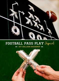 a person holding a football pass play trophy