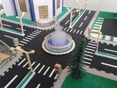 a toy model of a street with a fountain