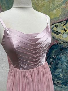 This is a beautiful and unique dress, by the designer Julia Clancy. It has an intricate silk satin bodice with decorative tucks and folds, and delicate silk straps. It has a long back zip The skirt is made of gorgeous silk chiffon, with frayed edge detail at the hem. It is fully lined. Measurements. Pit to pit 41cm Waist 72cm Skirt length from waist to hem 65cm This dress is in perfect condition. Sleeveless Satin Dress With Pleated Bodice, Silk Satin Dress With Ruched Bodice And Sweetheart Neckline, Silk Dress With Satin Finish And Sweetheart Neckline, Silk Pleated Dress With Fitted Bodice, Silk Bridesmaid Dress With Pleated Bodice, Silk Evening Dress With Pleated Bodice For Bridesmaids, Satin Dress With Pleated Bodice And Sweetheart Neckline, Sleeveless Silk Satin Dress With Pleated Bodice, Silk Prom Dress With Boned Bodice