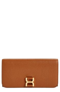 The iconic topstitching and tassel accent linked to the Marcie line distinguish this '70s-inspired leather wallet with a well-organized interior. Snap-flap closure Dual interior compartments with center zip-pocket divider; currency pockets; 12 card slots Leather Made in Italy Designer Handbags This brand has B Corp certification, representing business practices with emphasis on social and environmental performance, accountability and transparency This brand meets Nordstrom Responsible Brands cri Leather Wallet On Chain For Workwear, Leather Rectangular Wallet For Work, Tan Leather Wallet On Chain, Classic Tan Wallet On Chain For Formal Occasions, Classic Leather Wallet On Chain With Magnetic Closure, Cognac Leather Wallet, Chic Leather Wallet For Work, Modern Tan Leather Wallet, Classic Leather Trifold Clutch