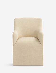 a beige chair on a white background with no one in the room to see it