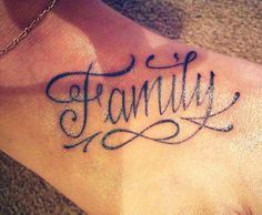 a foot with the word family written in cursive writing on it's side