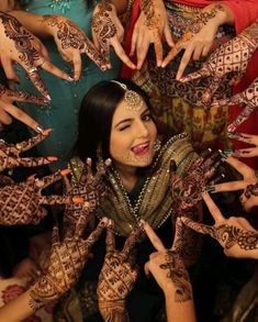 a group of women with their hands covered in hendikes, all showing different designs