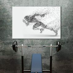 a weight bench with two barbells and a poster on the wall above it