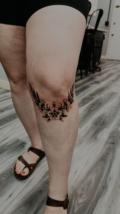 a woman with a tattoo on her leg