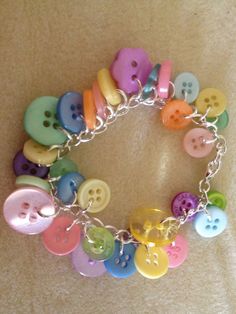 a bracelet with lots of different colored buttons