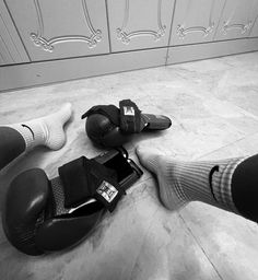 two pairs of boxing gloves laying on the floor