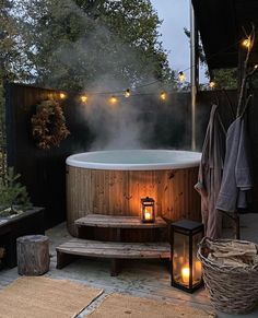 an outdoor hot tub surrounded by lights