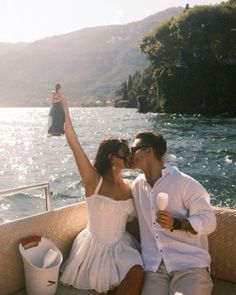 a man and woman are sitting on a boat