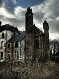 an old abandoned church in the middle of nowhere on a cloudy day with dark clouds