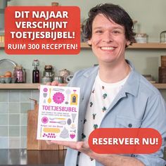 a man holding up a recipe book in front of a kitchen counter with the words, dit naar verbschut toetsbibbel rum 300 receptiben