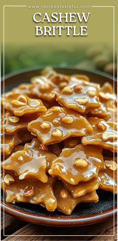 a plate full of caramel brittle on top of a wooden table with the words cashew brittle