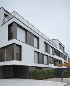 an apartment building with many windows and balconies