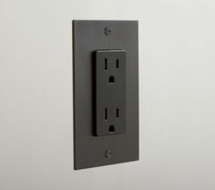 an electrical outlet is mounted on the wall