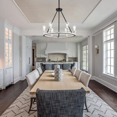 a large dining room table with chairs around it