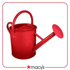 a red watering can with a handle on the side and a grater in the middle