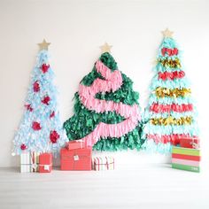 three christmas trees made out of tissue paper