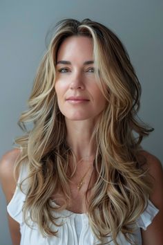 Embrace elegant long hairstyles for women over 40 that exude sophistication and youthfulness. Click to see more ideas.