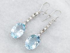 These beautiful earrings will be a stylish addition to any jewelry collection. Crafted with white gold, blue topaz, and diamonds, these drop earrings offer an elegant sparkle to any outfit. *Please note, there is a chip on the girdle of one of the blue topaz, and a chip on one of the diamonds. The piece has been priced accordingly. Metal: 14K White Gold Gem: 2 Blue Topaz totaling 13.26 Carats Gem Measurements: 10.0 x 14.2 mm, Oval Accents: 12 Diamonds totaling .32 Carats, SI in Clarity, G-H in Color Measurements: 10 x 46 mm SKU #: A28541 Each piece has been identified and graded by a Graduate Gemologist who has been certified by the Gemological Institute of America (GIA). We have six brick-and-mortar storefronts in Maine, Massachusetts, and New Hampshire and have been in business for over Gift Blue Topaz Drop Earrings Jewelry, White Gold Blue Topaz Drop Earrings, Blue Topaz Drop Earrings For Gift, White Topaz Earrings For Wedding, Fine Jewelry, Multi-stone Blue Topaz Earrings As Gift, White Gold Drop Earrings, Aquamarine Pendant, Antique Engagement, Topaz Earrings