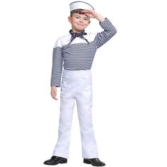 a young boy in sailor costume posing for the camera with his hands on his head