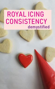 royal icing consisting of heart shaped cookies and a red cone with the words demystfied on it