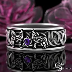 See this ring with more stones and metals: www.etsy.com/shop/CelticEternity?search_query=1703 Band Height 7.4mm Stones: 1x 2mm Amethyst Two intricate Celtic wolves join voices over a sparkling gemstone. The silhouette is created with Celtic knots and blends seamlessly with the traditional Celtic knots that surround it. The wolf is a symbol of guardianship, ritual, loyalty, and spirit. Wolf has the ability to make quick and firm emotional attachments, and can trust their own instincts. Every ring is handmade to order and in YOUR CUSTOM size; we do not keep backstock. Please buy our refundable ring sizer (BEFORE ORDERING) as most rings cannot be resized because of the continuous knotwork: www.etsy.com/listing/937178260 About This Item: Cast in solid 925 sterling silver (nickel-free), these r Polished Band Jewelry For Gifts, Polished Band Jewelry Gift, Polished Finish Band Jewelry Gift, Polished Finish Band Jewelry For Gift, Polished Band Jewelry For Wedding, Symbolic Intricate Design Jewelry For Anniversary, Symbolic Wedding Jewelry With Intricate Design, Hallmarked Jewelry For Wedding, Sterling Silver Band Jewelry For Weddings