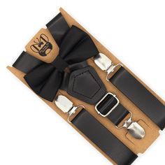 This beautiful Black bow tie & black leather suspenders set is a perfect choice for a holiday, wedding, groomsmen, best man, ring bearer outfit, birthday celebration or any other special occasion! SIZING:   Х-SMALL: 6mo-4yrs  * Bow Tie: 4 in wide  * Suspenders: Adjustable from 16" to 27" (38 cm - 68 cm), X- back. SMALL: 5yrs-10yrs  * Bow Tie: 4 in wide * Suspenders: Adjustable from 20" to 32" (50 cm - 85 cm), X- back. MEDIUM: 10yrs-18yrs (up to 5'6") * Bow Tie: 4.5 in wide * Suspenders: Adjustab Dapper Suspenders For Party, Classic Suspenders For Suit And Tie At Party, Classic Adjustable Belts And Suspenders For Party, Black Bow Tie For Wedding, Classic Black Belts And Suspenders For Party, Elegant Black Belts And Suspenders For Party, Elegant Adjustable Belts And Suspenders For Black Tie, Black Adjustable Suit And Tie Accessories With Satin Bow, Black Bow Tie Suit Accessories Gift