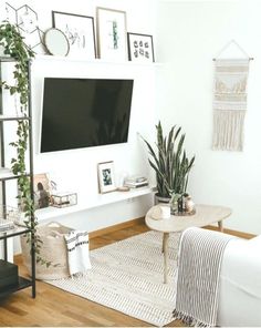 a living room filled with furniture and a flat screen tv