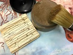 a close up of a brush and other items on a table