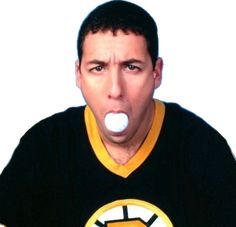 a man making a funny face with an object in his mouth